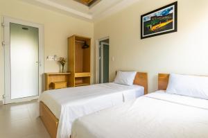 Cama o camas de una habitación en D Central Hoi An Homestay