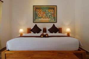 Llit o llits en una habitació de Crystal Bay Villa & Residence