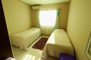 Cama o camas de una habitación en Villa das Ondas - Mariscal