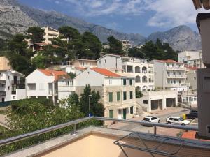a view from the balcony of a city with buildings at Apartments Juric in Baška Voda