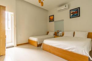Cama o camas de una habitación en D Central Hoi An Homestay