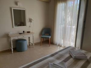 Postel nebo postele na pokoji v ubytování Alkyon Hotel