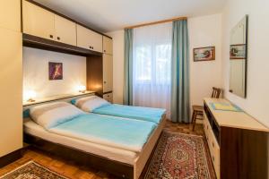Postel nebo postele na pokoji v ubytování Apartments Palme
