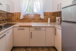 Kuchyň nebo kuchyňský kout v ubytování Apartments Palme + 34 fotografií
