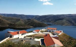 an aerial view of a house on top of a lake at Alojamento Rural de Covelas in Covelas