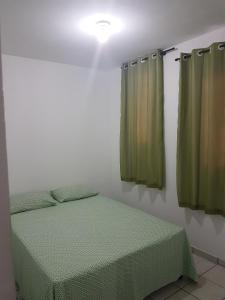 Ліжко або ліжка в номері Casa em Ponta Negra