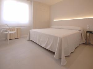 Tu&Me Resort - Adults Only tesisinde bir odada yatak veya yataklar