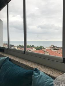 a view of the ocean from a window at Senturkler Suite in Trabzon