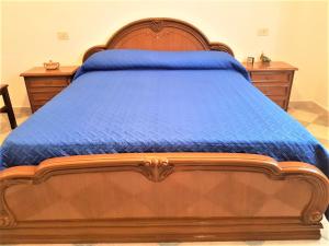 Een bed of bedden in een kamer bij Villetta Su Barrali