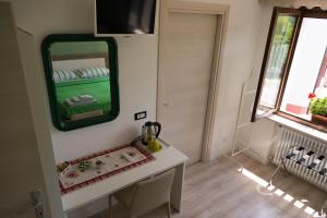 TV a/nebo společenská místnost v ubytování Casa Verde Belluno