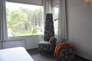 Giường trong phòng chung tại Altué Apart Hotel +35 ảnh