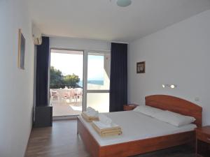 Postel nebo postele na pokoji v ubytování Boarding house Vide