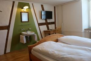 מיטה או מיטות בחדר ב-Hotel Lowen