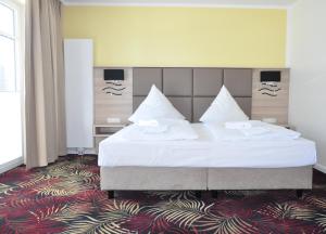 Krevet ili kreveti u jedinici u okviru objekta Avalon Hotel Bellevue