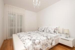 Postel nebo postele na pokoji v ubytování Apartman Ramljak