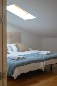Posteľ alebo postele v izbe v ubytovaní Sánchez Pastor FreshApartments