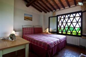 Katil atau katil-katil dalam bilik di Podere Il Pino