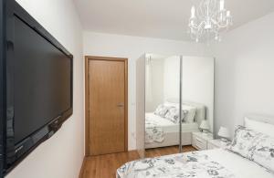 Postel nebo postele na pokoji v ubytování Apartman Ramljak