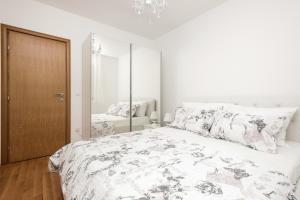 Postel nebo postele na pokoji v ubytování Apartman Ramljak