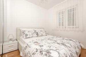 Postel nebo postele na pokoji v ubytování Apartman Ramljak