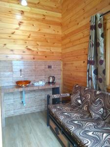 Postel nebo postele na pokoji v ubytování Cozywoods Hill Resort