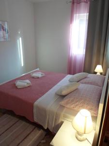 Postel nebo postele na pokoji v ubytování Apartman Lapis