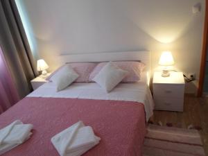 Postel nebo postele na pokoji v ubytování Apartman Lapis