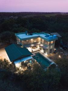 an aerial view of a house with a swimming pool at Forestville Yala in Yala