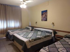 Ένα ή περισσότερα κρεβάτια σε δωμάτιο στο Hotel Suma Huasi +42 φωτογραφίες