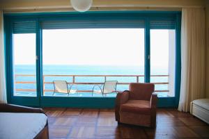 a bedroom with a view of the ocean from a balcony at Villa Domus 1938 in Sestri Levante