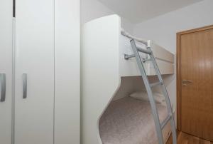 Postel nebo postele na pokoji v ubytování Apartman Ramljak