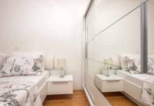 Postel nebo postele na pokoji v ubytování Apartman Ramljak