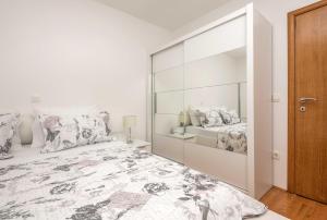 Postel nebo postele na pokoji v ubytování Apartman Ramljak