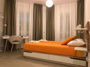 מיטה או מיטות בחדר ב-A Matera "Sotto i pini"