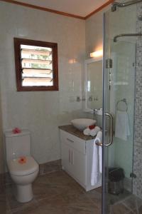a bathroom with a toilet and a sink and a shower at Armony Residence Holiday Apartment 2 in Victoria