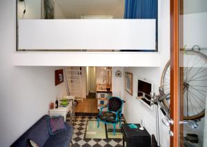 a view of a living room with a bike at siciliacasevacanze - Marina Domus Depandance in Marina di Ragusa +22 photos