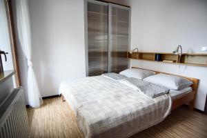 Postel nebo postele na pokoji v ubytování Apartamenty Neptun House