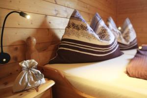 a room with a bed with pillows on it at Gasserhütte in Innerkrems
