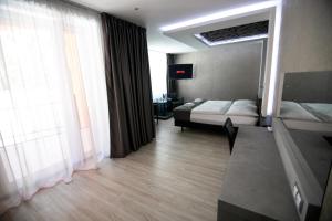 Postel nebo postele na pokoji v ubytování Hotel U Kostela