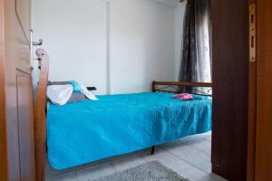 A bed or beds in a room at "By The Sea" Family apartments