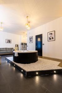 a room with a table in the middle of a room at Mun&igrave; Boutique Flat by Babylon Stay in Naples