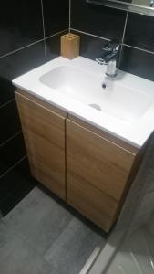 a bathroom with a white sink and a mirror at Le Montana in Les Deux Alpes +22 photos