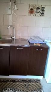 a kitchen with a sink and a counter top at Casa Ancora Sulina in Sulina +28 photos