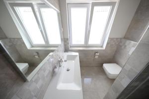 Łazienka w obiekcie Apartmani Postimana