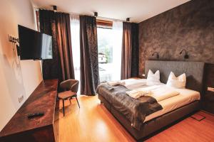 Postel nebo postele na pokoji v ubytování ACTIVE by Leitner's