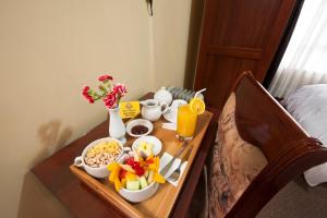 Postel nebo postele na pokoji v ubytování Hotel Mabey Cusco
