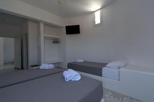 Posteľ alebo postele v izbe v ubytovaní Teoria Paros - Matsas Windmill