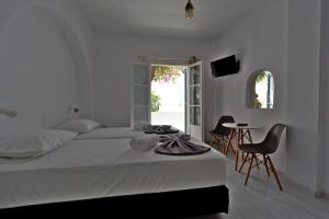 Posteľ alebo postele v izbe v ubytovaní Teoria Paros - Matsas Windmill