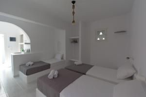 Posteľ alebo postele v izbe v ubytovaní Teoria Paros - Matsas Windmill