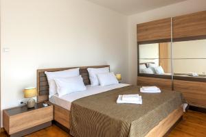 Posteľ alebo postele v izbe v ubytovaní Apartments Villa Adriatic